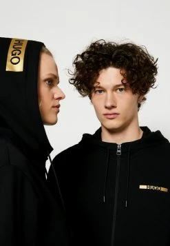 Sortie 🔥 HUGO DINORO METALLIC UNISEX - Sweat à Capuche Zippé - Black/gold 🎉 -HUGO Sales 061eb0b7d421477fa7f150633f5ae720